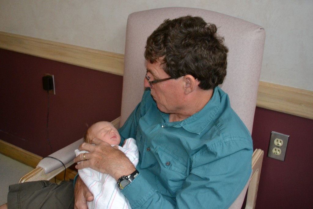 Grandfather and newborn baby