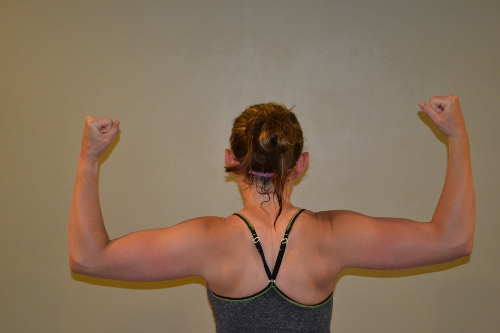 Postpartum Mom Flexing Back Muscles