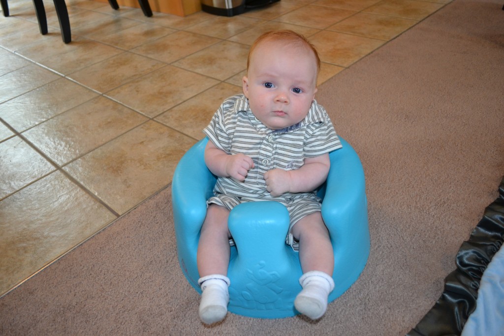 Baby sitting in bumbo