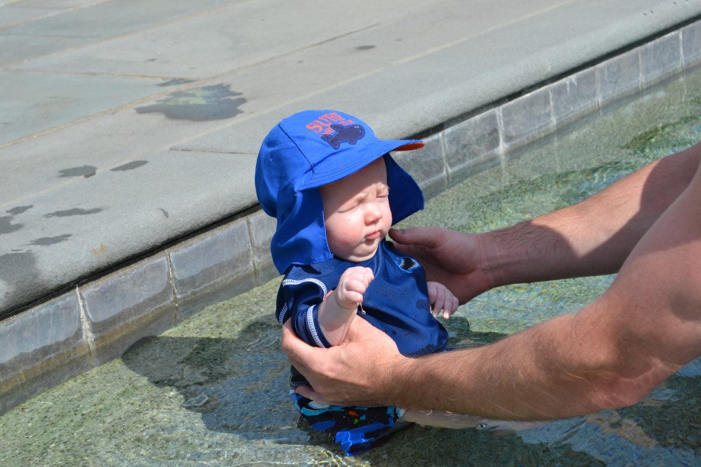 Baby sitting in pool