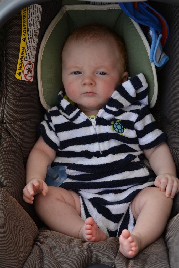 Baby in comfortable clothes after swimming.