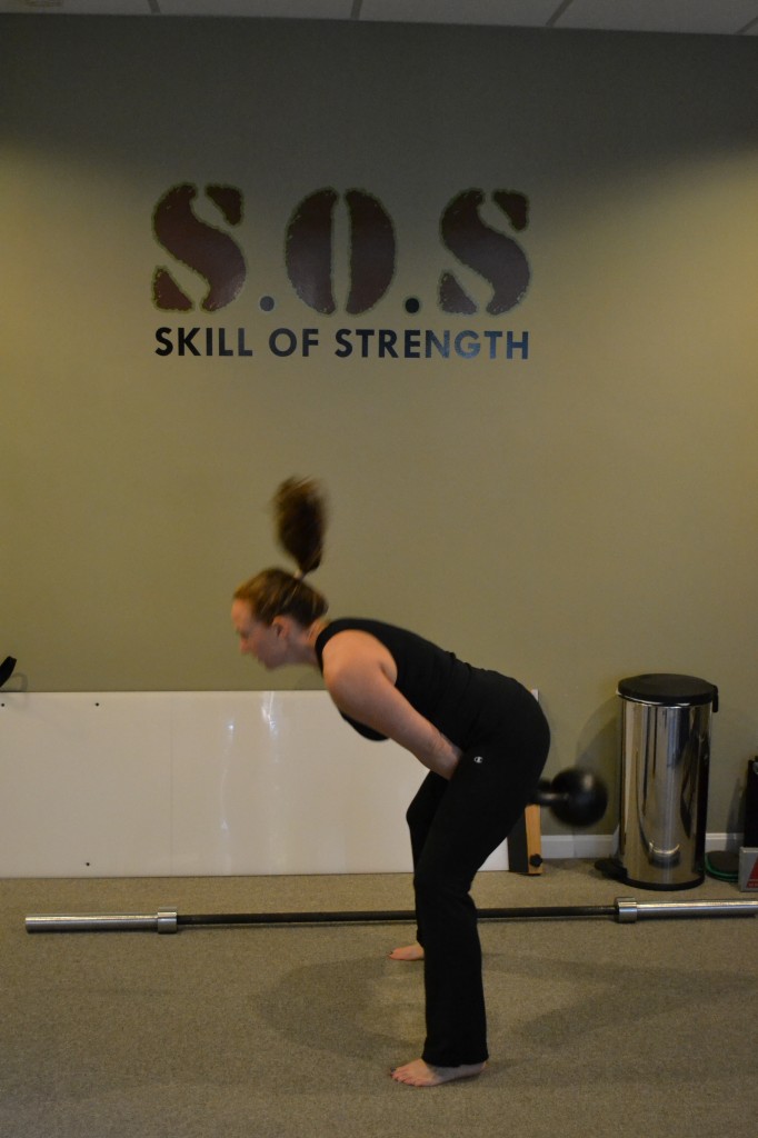 Woman swinging kettlebells