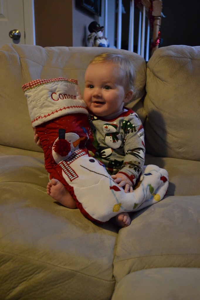 Baby on Christmas with his stocking