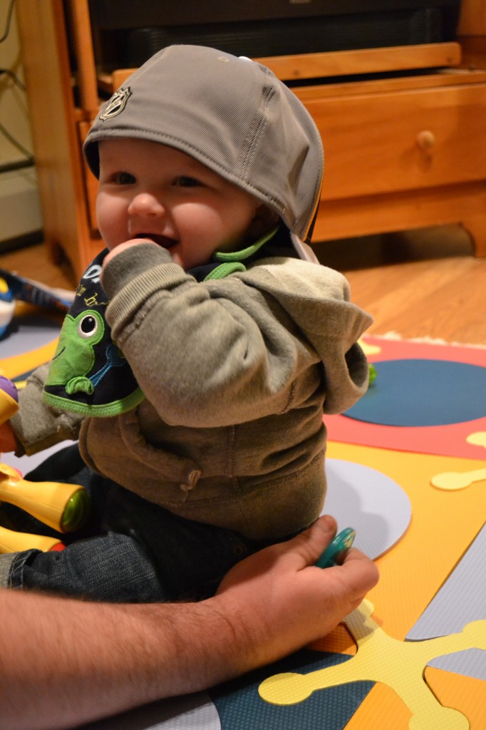 Smiling baby with baseball hat