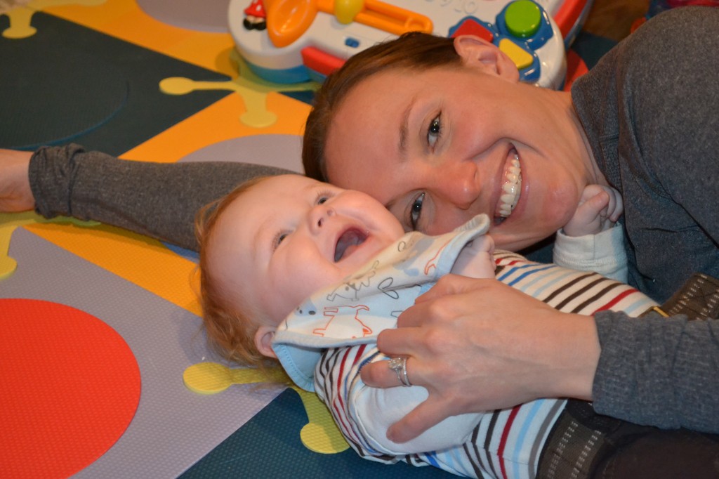 Baby smiling with mom