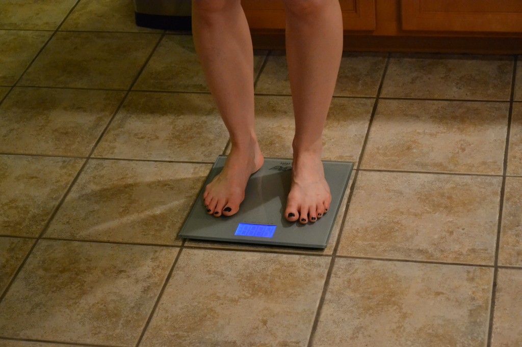 Woman Weighing Self