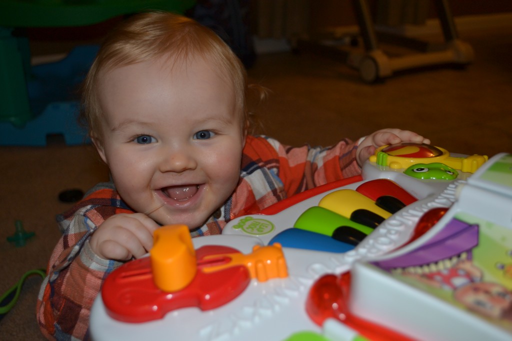 Baby Boy Playing With Learning Table