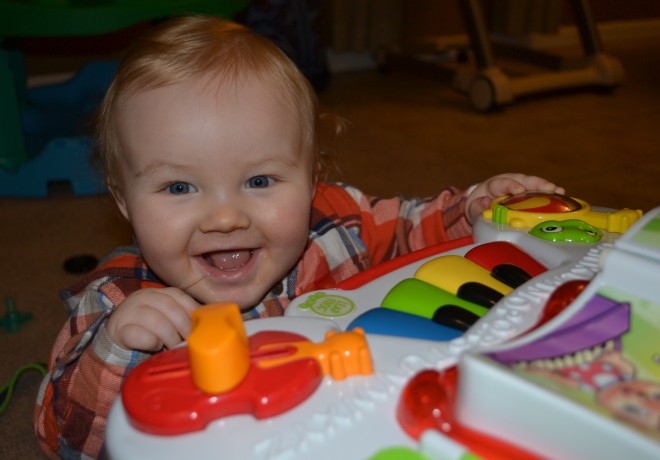 Baby Boy Playing With Learning Table