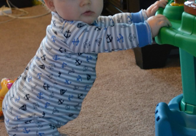 Baby Pulling Up on Toy