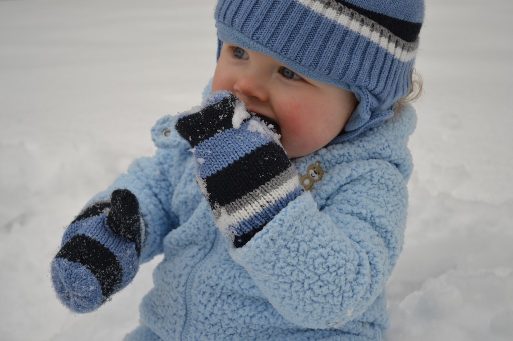 Baby Eating Snow on Gloves