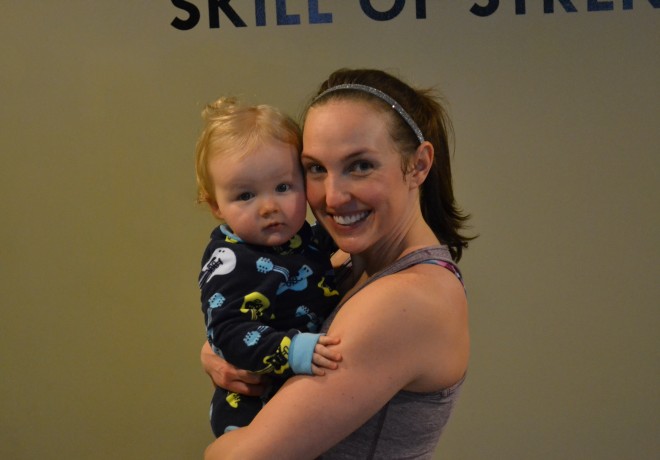 Mom Holding Baby After Workout
