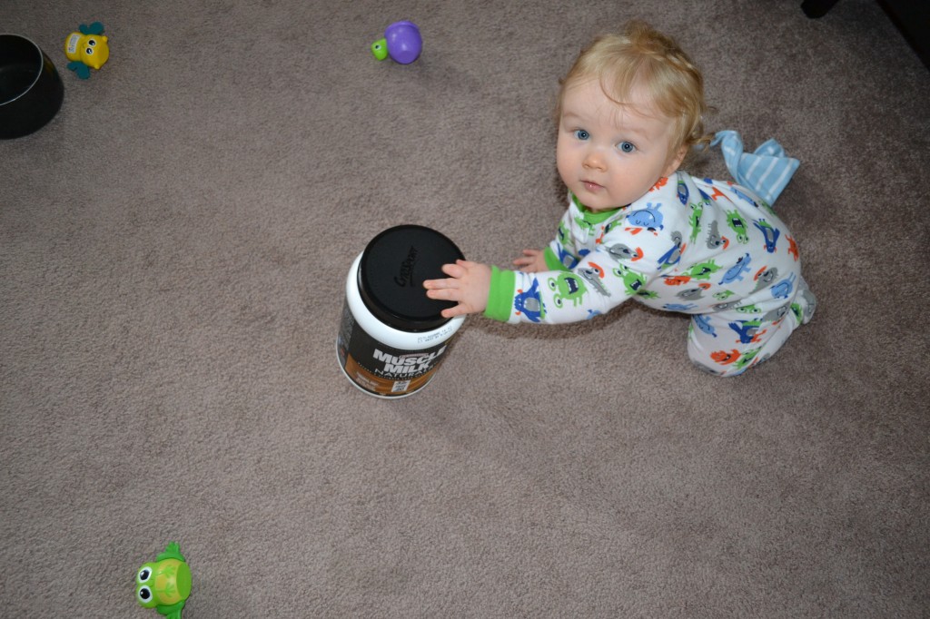 Baby Playing with Protein Powder Tub