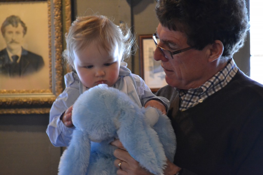 Grandfather Showing Baby Stuffed Animal