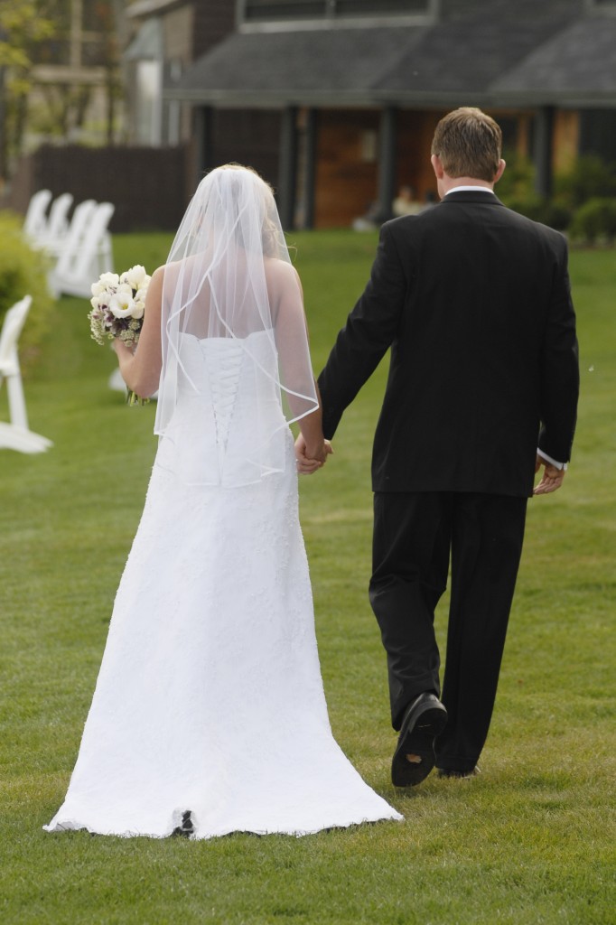 Bride with Veil and Groom Walking
