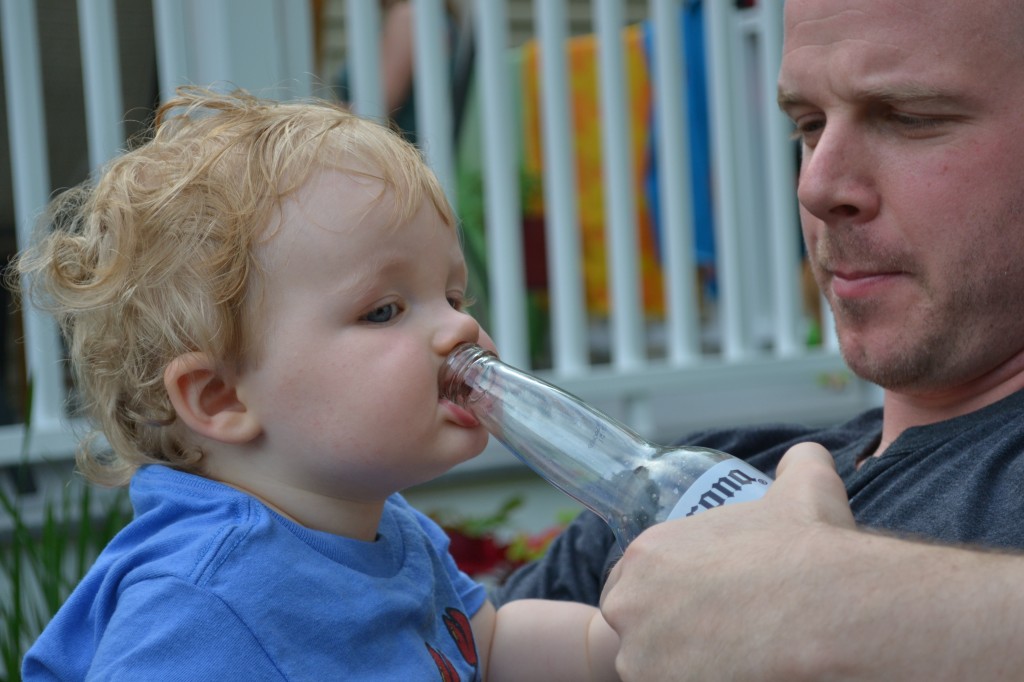 Beer Bottle in Baby's Mouth