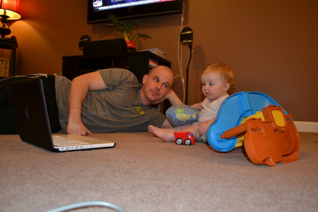 Dad and Baby Listening to Music on Computer