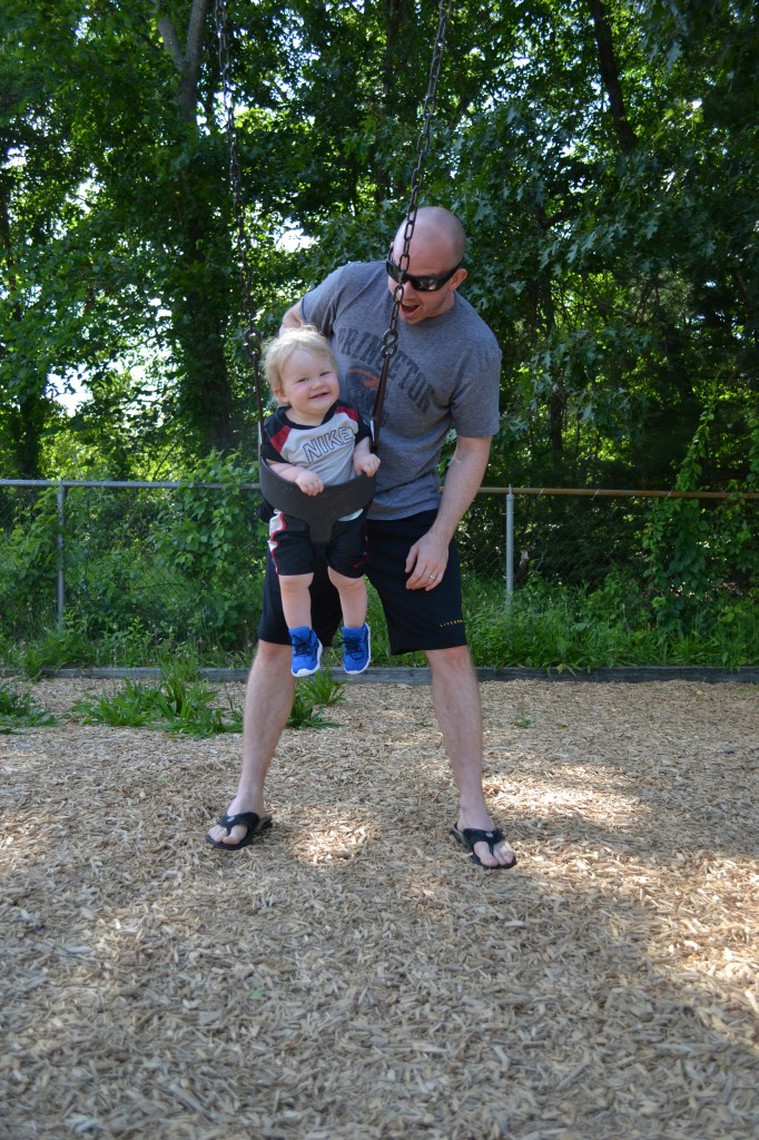 Dad Pushing Son on Swing