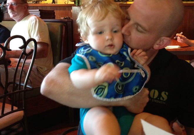 Dad Kissing Baby at Dinner