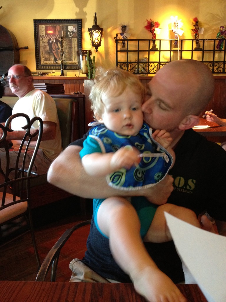 Dad Kissing Baby at Dinner