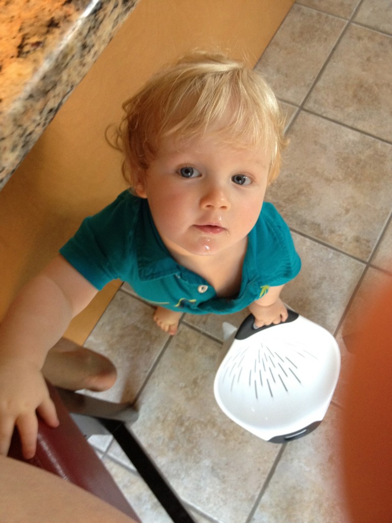 One Year Old Using Strainer as Toy