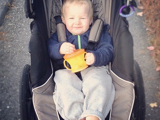 Toddler in Football Slippers Taking Walk with Mom