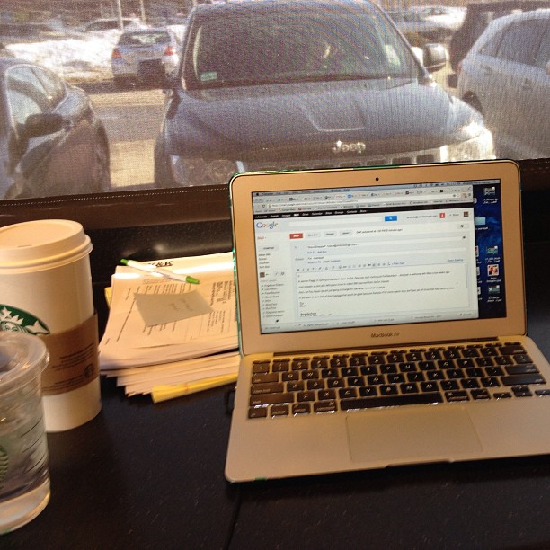 Working Mom Catching Up on Work at Starbucks